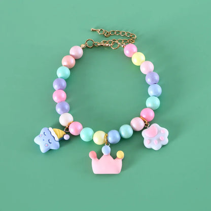 Adjustable resin pet collar with macaron designs in six colours, showing sizing from 15-38cm
