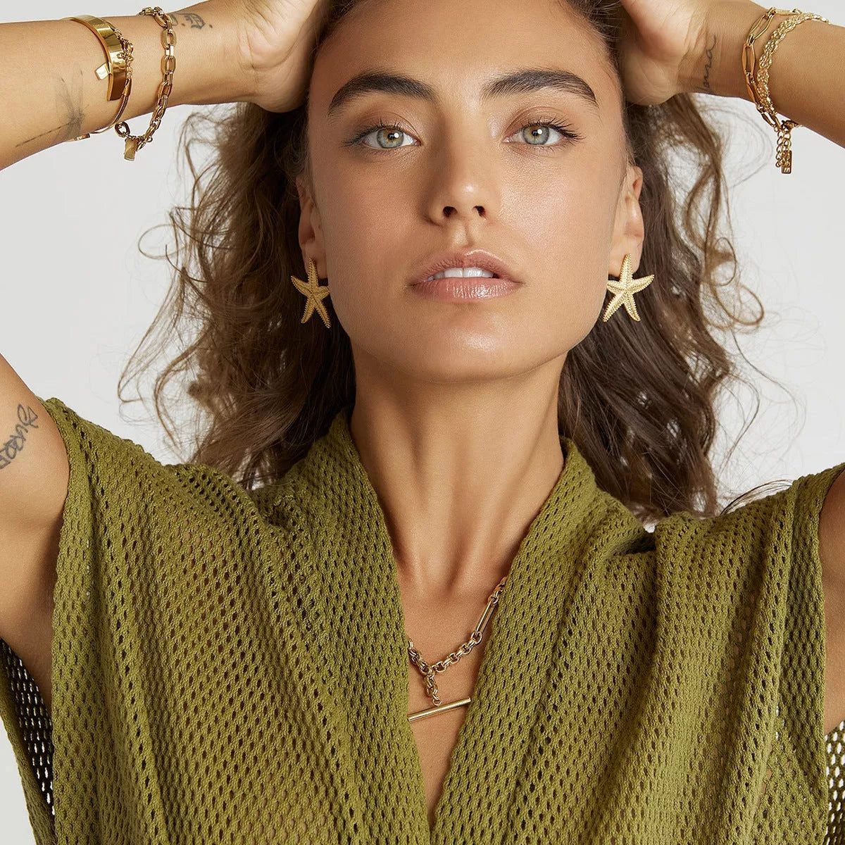 Serene Gold Starfish Earrings in stainless steel with gold electroplated finish