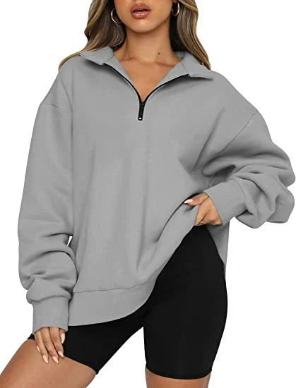 Women's zip turndown collar sweatshirt in various colors, showcasing loose fit and zipper detail.