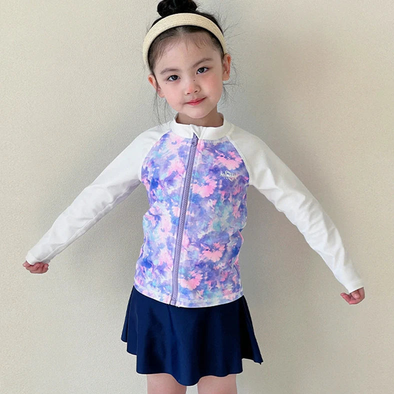 Girls' long sleeve swimsuit with split skirt in gradually varied pink colour, showing complete arm coverage and skirt design