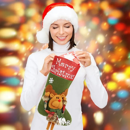Set of three large red, white, and brown Christmas stockings with 3D Santa, Snowman, and Reindeer designs hanging on a tree.