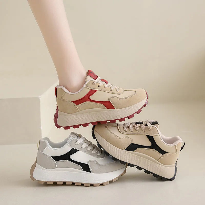 Women's solid colour low-top sports shoes with flat platform sole and lace-up front.