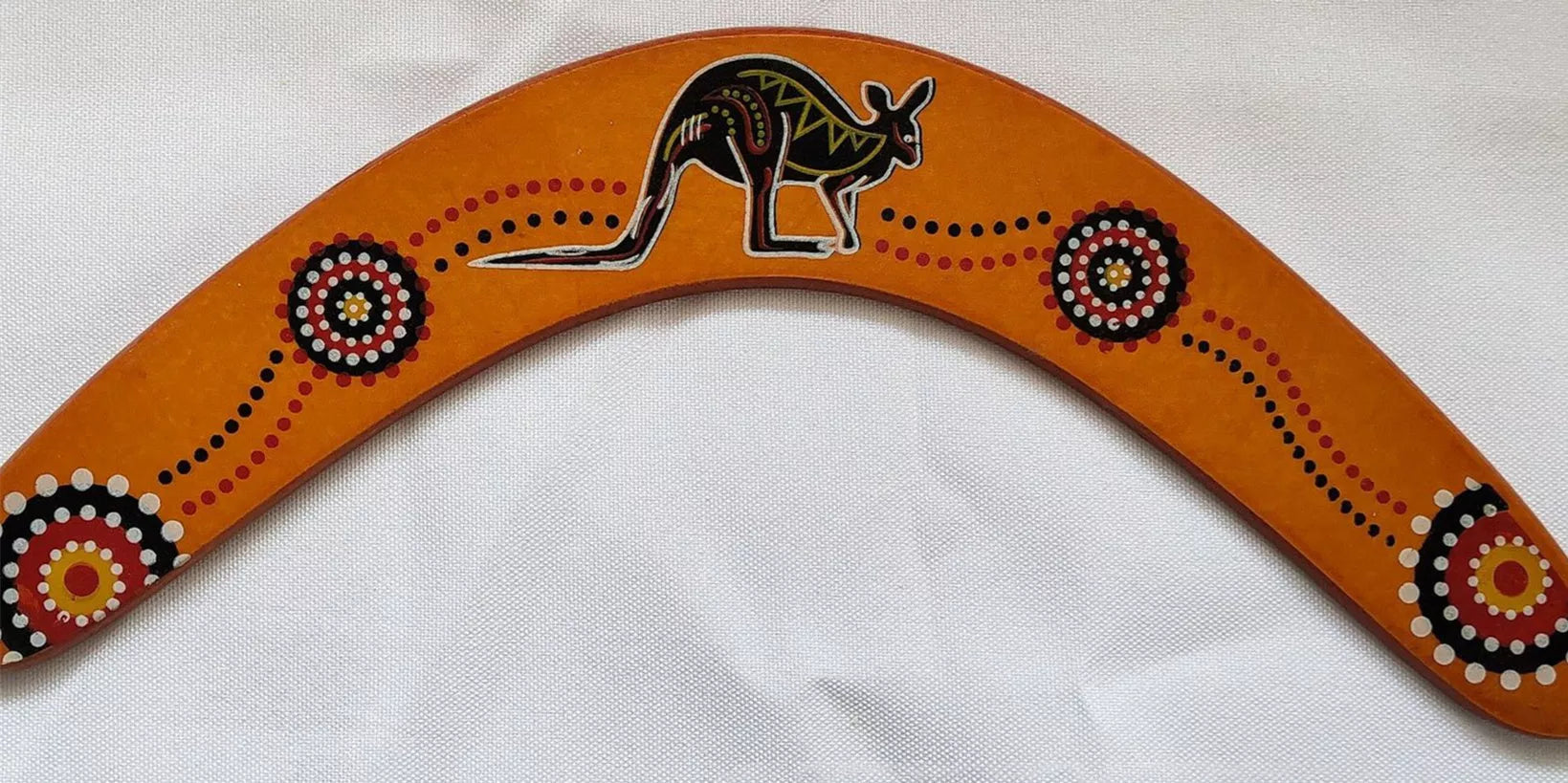Black wooden revolving dart with kangaroo design for outdoor sports