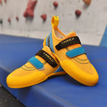 Beginner unisex rock climbing shoes with Velcro straps and a coloured rubber sole.