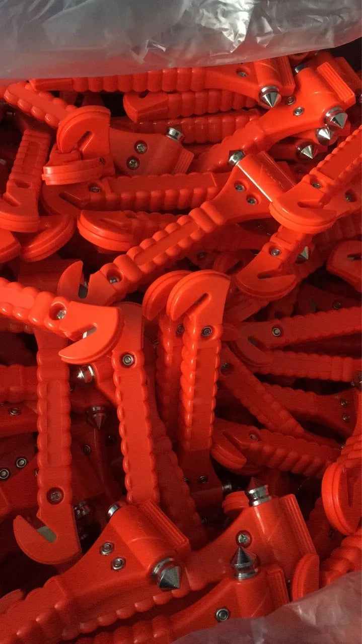 Red car emergency hammer with window breaker and seatbelt cutter tool