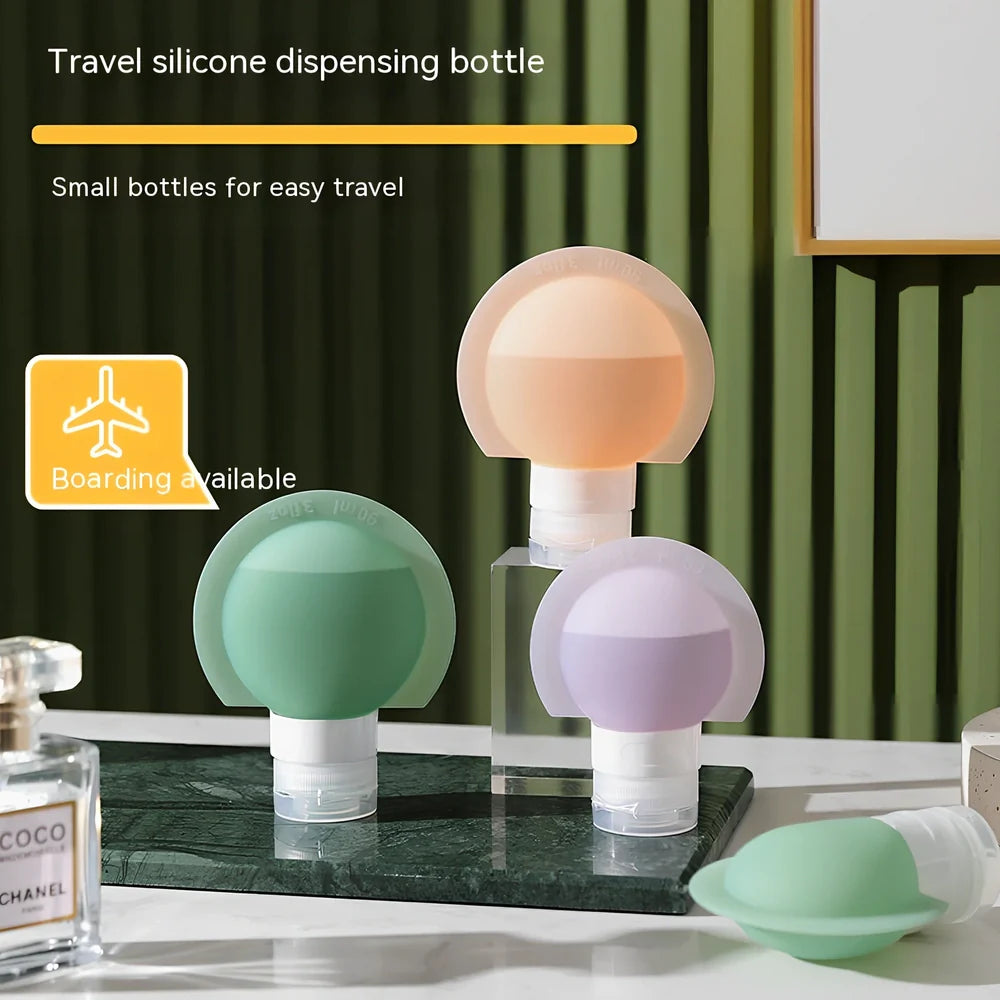 Three silicone travel bottles in different colours with stickers, showing 60ml and 90ml sizes for shampoo and cosmetics