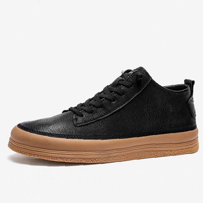 Men's black casual shoes with round toe, lanyard closure, and soft rubber soles on a neutral background