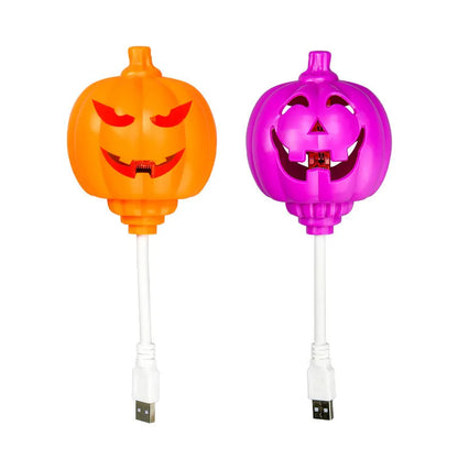 Plastic pumpkin decorative lamp with USB cable, available in purple or yellow light, measuring 22cm tall