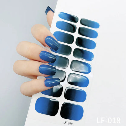 Sheet of 16 small design nail art stickers including cross, rose, tulip and marble patterns.