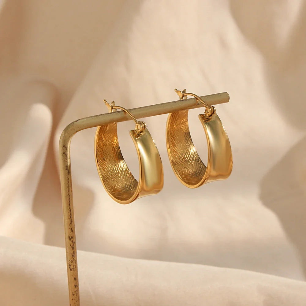 Geometric gradient gold earrings with ellipse design, perfect for women seeking modern elegance