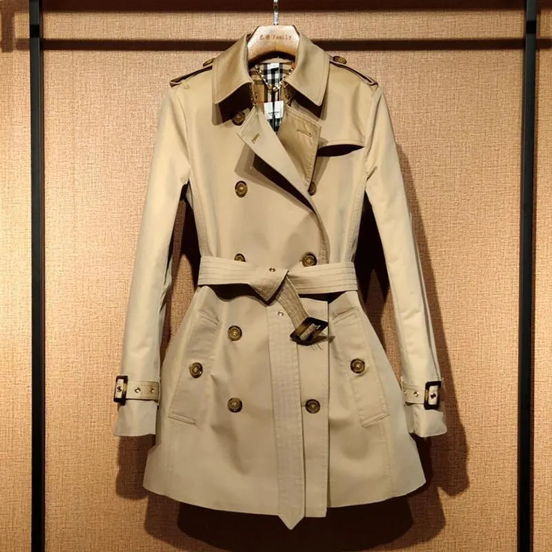 Khaki women's trench coat with double-breasted front and structured shoulder detailing