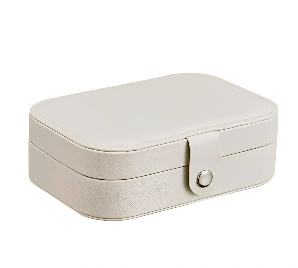 Three-layer travel jewellery box with PU leather exterior and secure closure for organised accessory storage