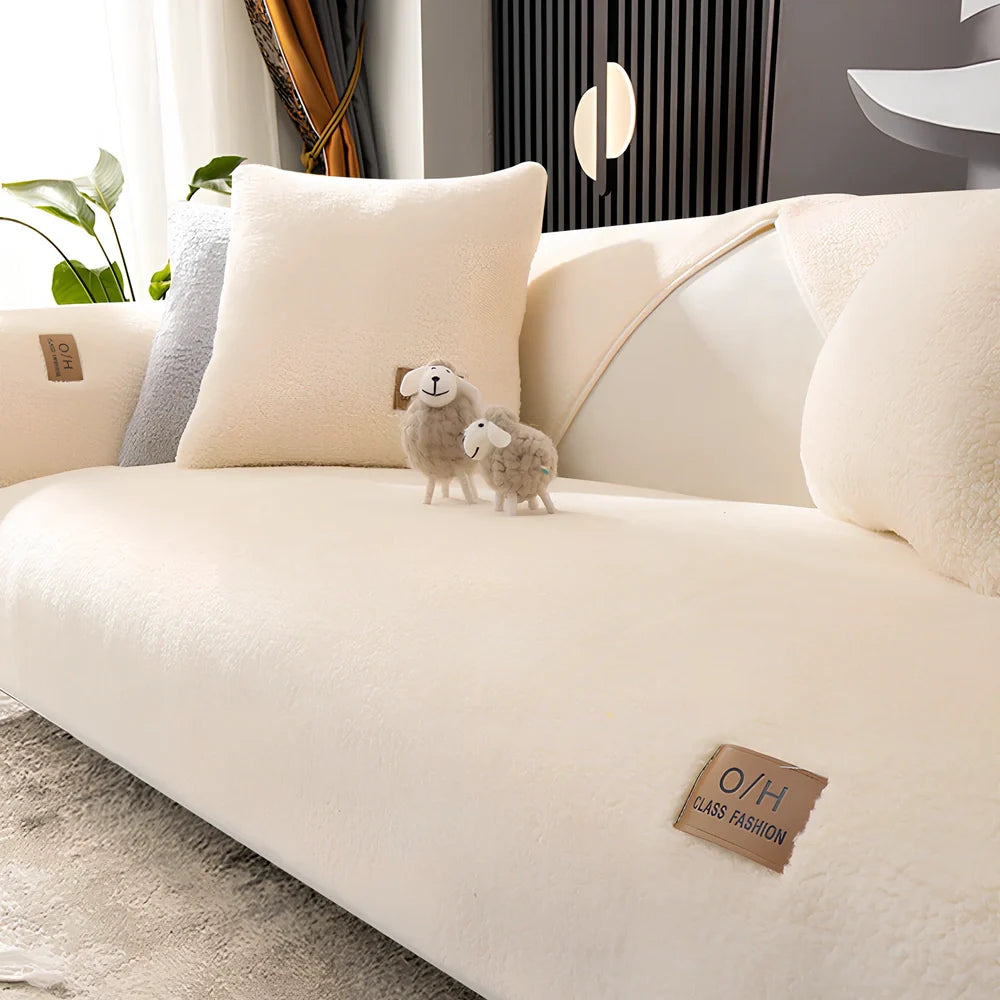 Lambswool sofa cushion with removable 45x45cm cover in solid beige colour on grey sofa