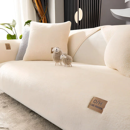 Lambswool sofa cushion with removable 45x45cm cover in solid beige colour on grey sofa