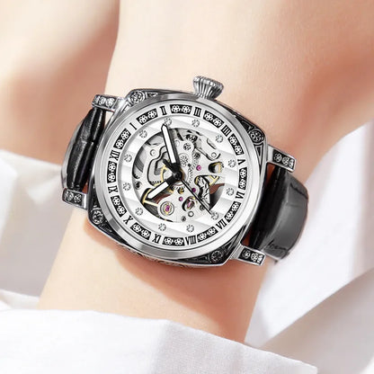 Mechanical watch with luminous hands on leather belt, stainless steel case, showing black colour option