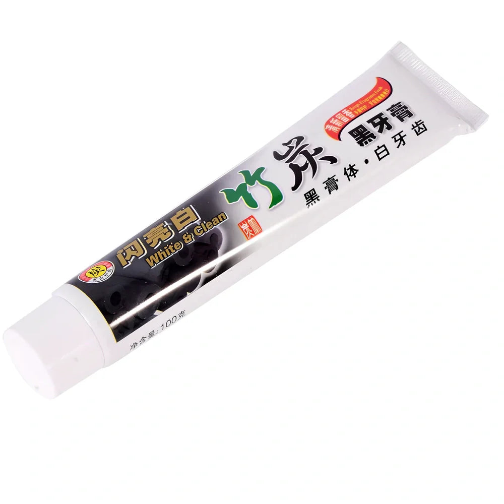 Bamboo charcoal toothpaste tube with black formula for dental stain removal and oral bacteria elimination