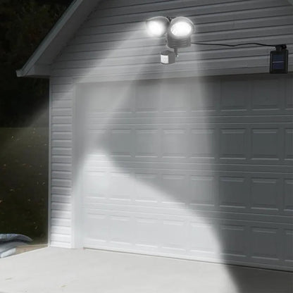Black dual-head solar security spotlight with motion sensor for outdoor wall mounting