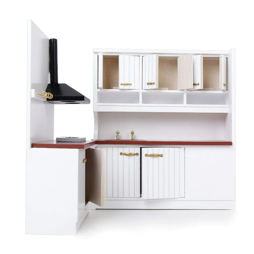 White European-style dollhouse kitchen cabinets with working doors and metal handles on a wooden surface.