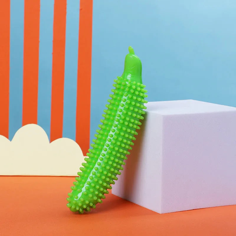 Green, pink, and purple cucumber-shaped durable dog chew toy for teething and training.