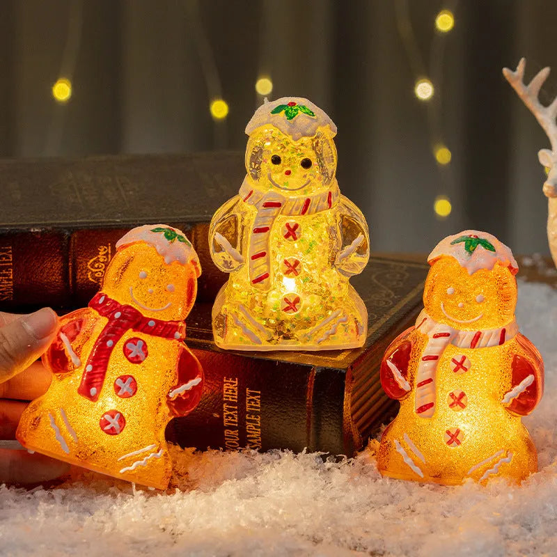 Glowing gingerbread man Christmas ornament measuring 6.5cm wide with LED lights and red scarf