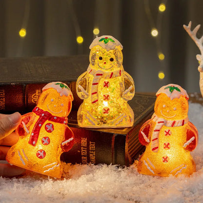 Glowing gingerbread man Christmas ornament measuring 6.5cm wide with LED lights and red scarf