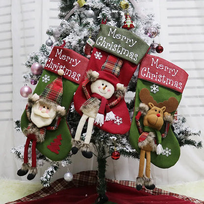 Set of three large red, white, and brown Christmas stockings with 3D Santa, Snowman, and Reindeer designs hanging on a tree.