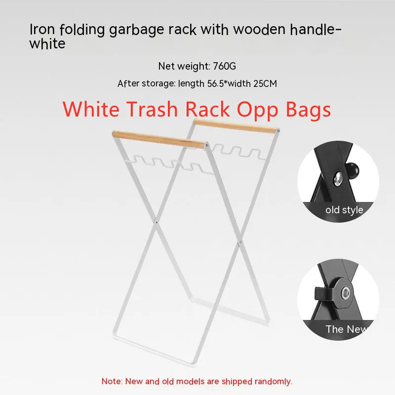 Black iron folding trash rack with wooden handles mounted on a wall holding a recycling bag.