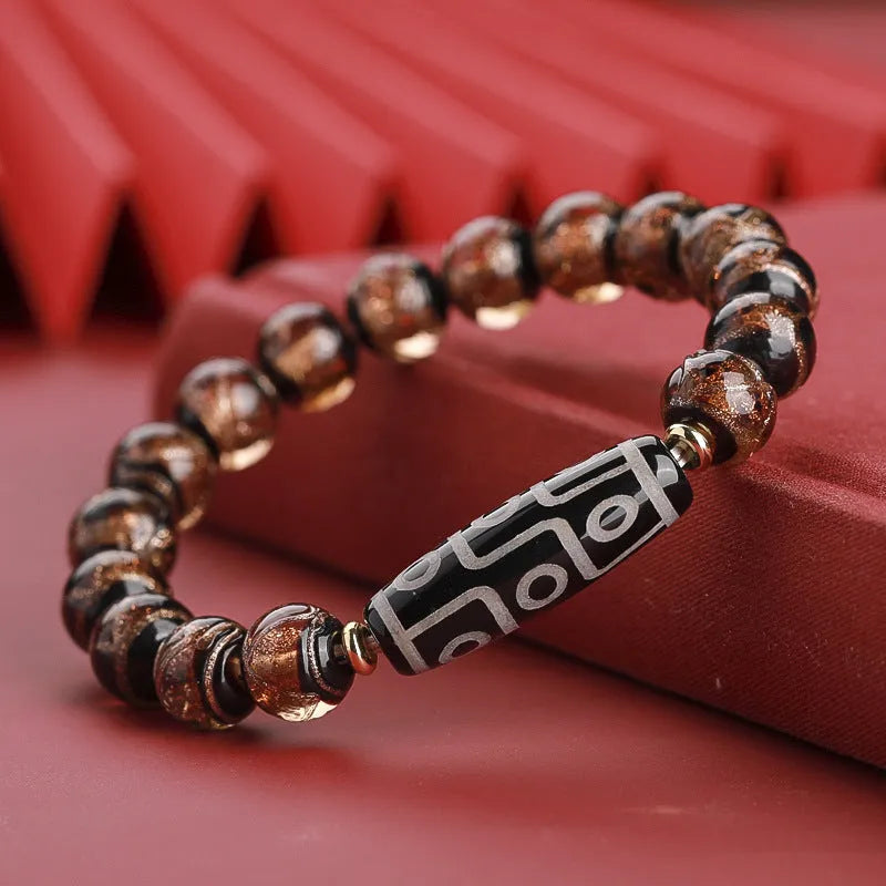 Colourful Chinese-style coloured glaze bracelet with auspicious patterns and snake symbol on beads.