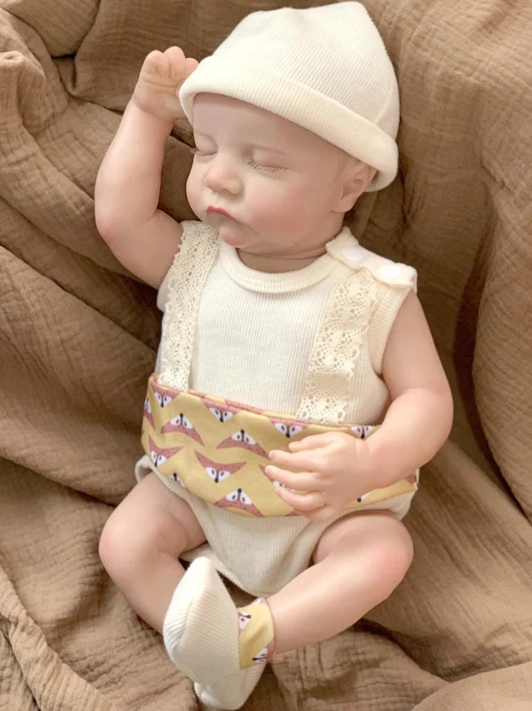 18-inch reborn doll with cloth body and hand-painted vinyl head wearing pink romper