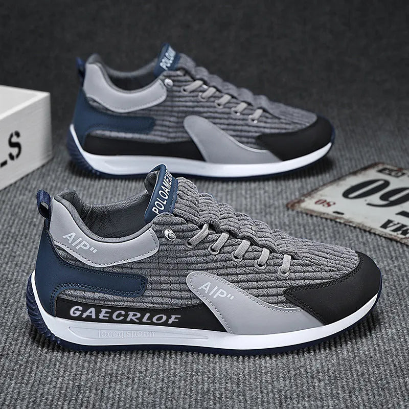 Men's grey and green mesh running shoes with lace-up front and low-top ankle design