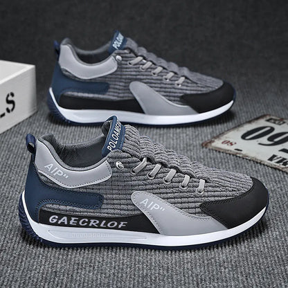 Men's grey and green mesh running shoes with lace-up front and low-top ankle design