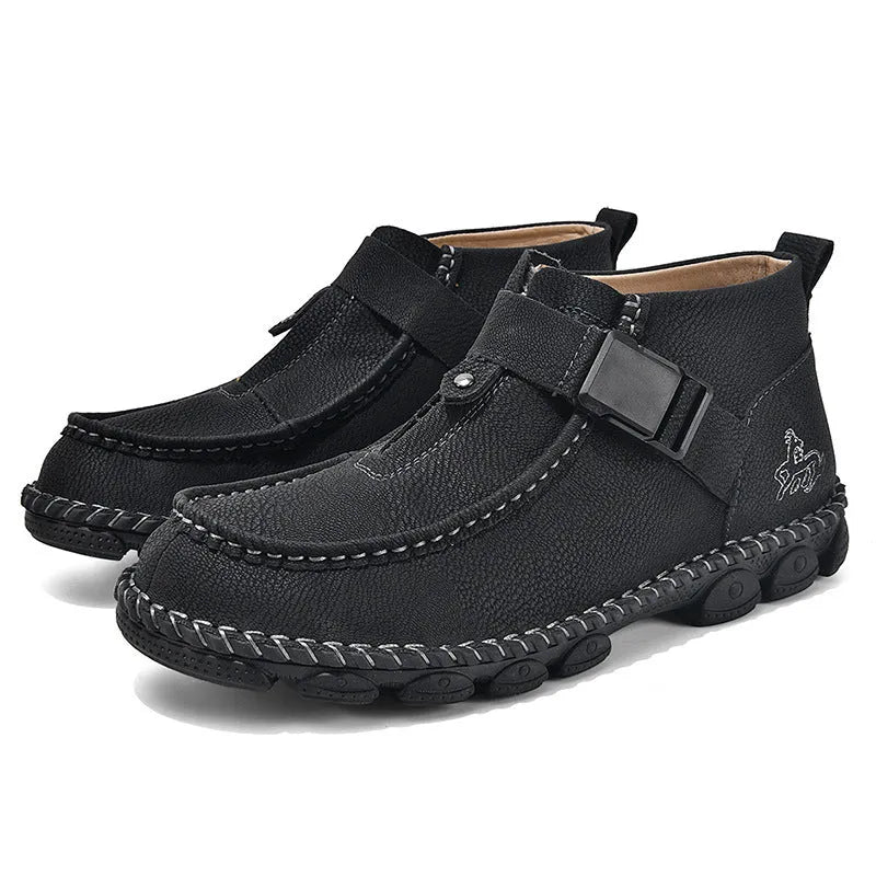 Casual flat bottom slip on shoes in brown with visible handmade sole stitching on a wooden floor.