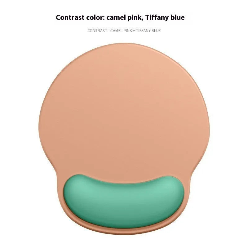 Silicone mouse mat with wristband in a gradient blue black colour pattern on a desk.