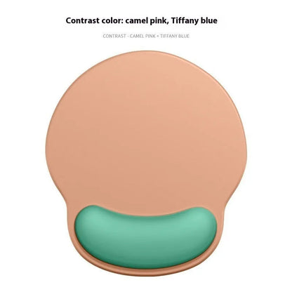 Silicone mouse mat with wristband in a gradient blue black colour pattern on a desk.