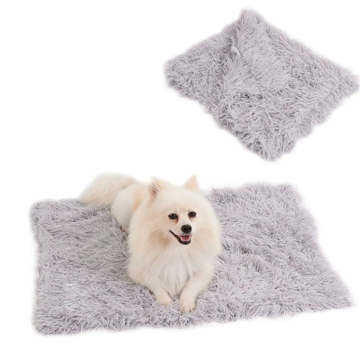 Light grey velvet pet blanket draped over a sofa next to a sleeping dog