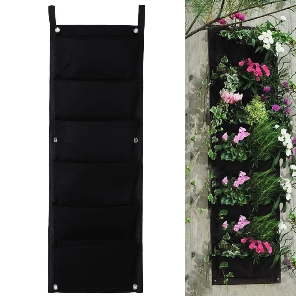 Vertical wall garden planting bag with 18 pockets hanging on outdoor wall with growing herbs