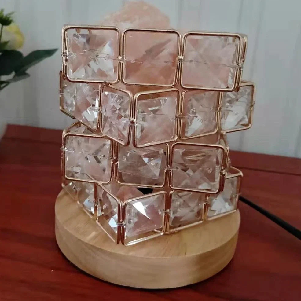 Himalayan salt lamp with wooden base and dimmable switch showing pink and orange salt rocks