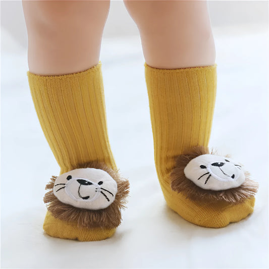 Cotton baby floor socks in assorted colours and patterns including bows, stars, and animal designs.