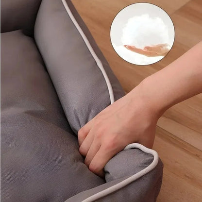 Grey waterproof Oxford cloth dog sofa bed on a wooden floor