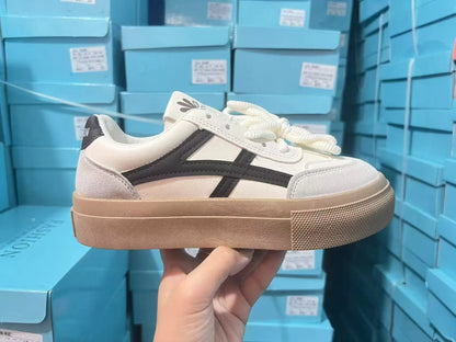 Blue and brown low-top casual sports shoes with round toe and flat rubber sole.