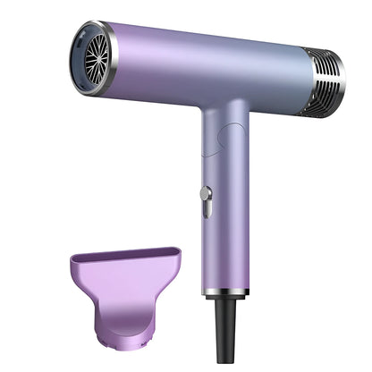 Green and purple foldable hair dryer with collapsed handle showing compact travel size