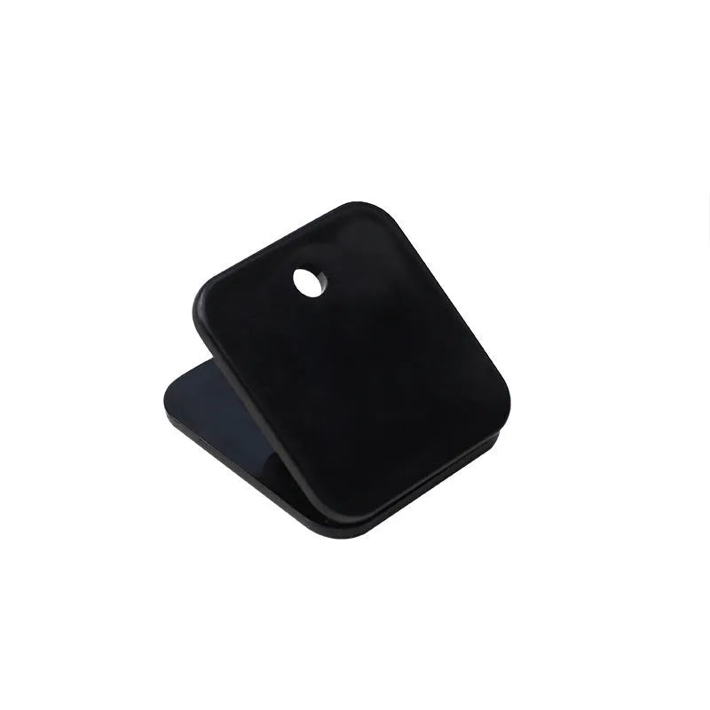 Square plastic photo holder in black, white, and transparent colour options on desk