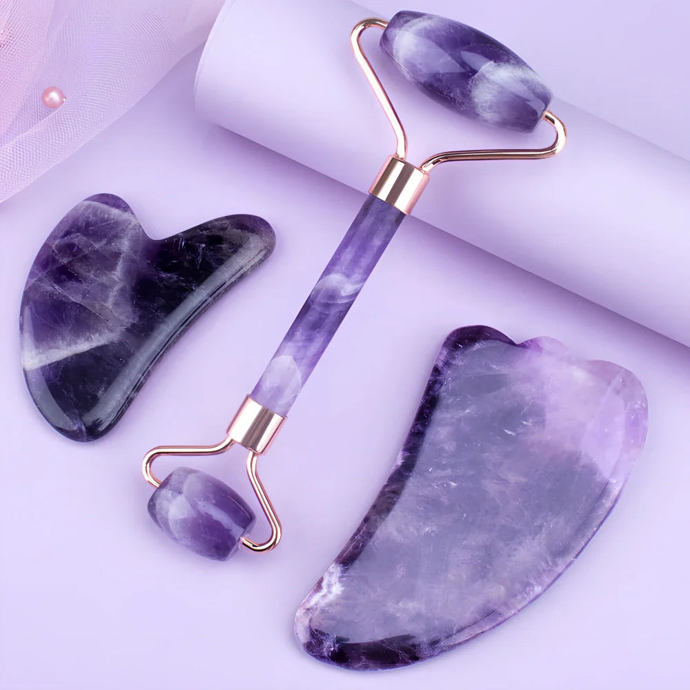 Amethyst facial roller set with heart-shaped gua sha and claw massage tools on white background