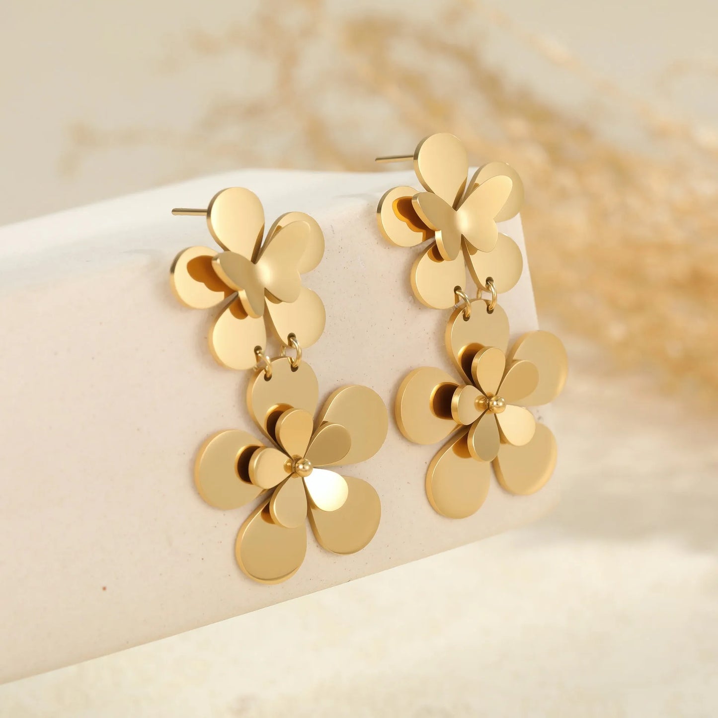 Gold electroplated stainless steel flower butterfly earrings for women with geometric and animal zodiac designs