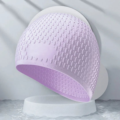 Silicone water drop swimming cap for adults shown in one of nine solid colours.