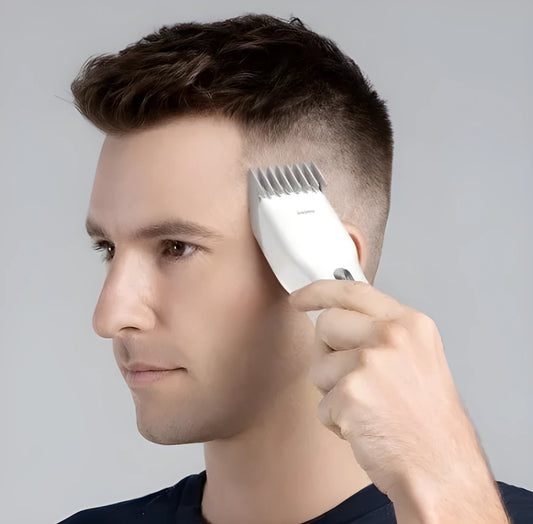 Boost model cordless hair clippers in black or white with ceramic blade and adjustable comb