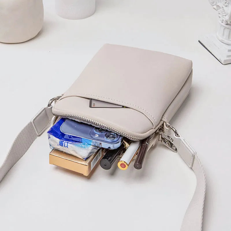 Solid colour mobile phone bag with adjustable strap showing 14.5x5.5x19cm dimensions and PU material construction