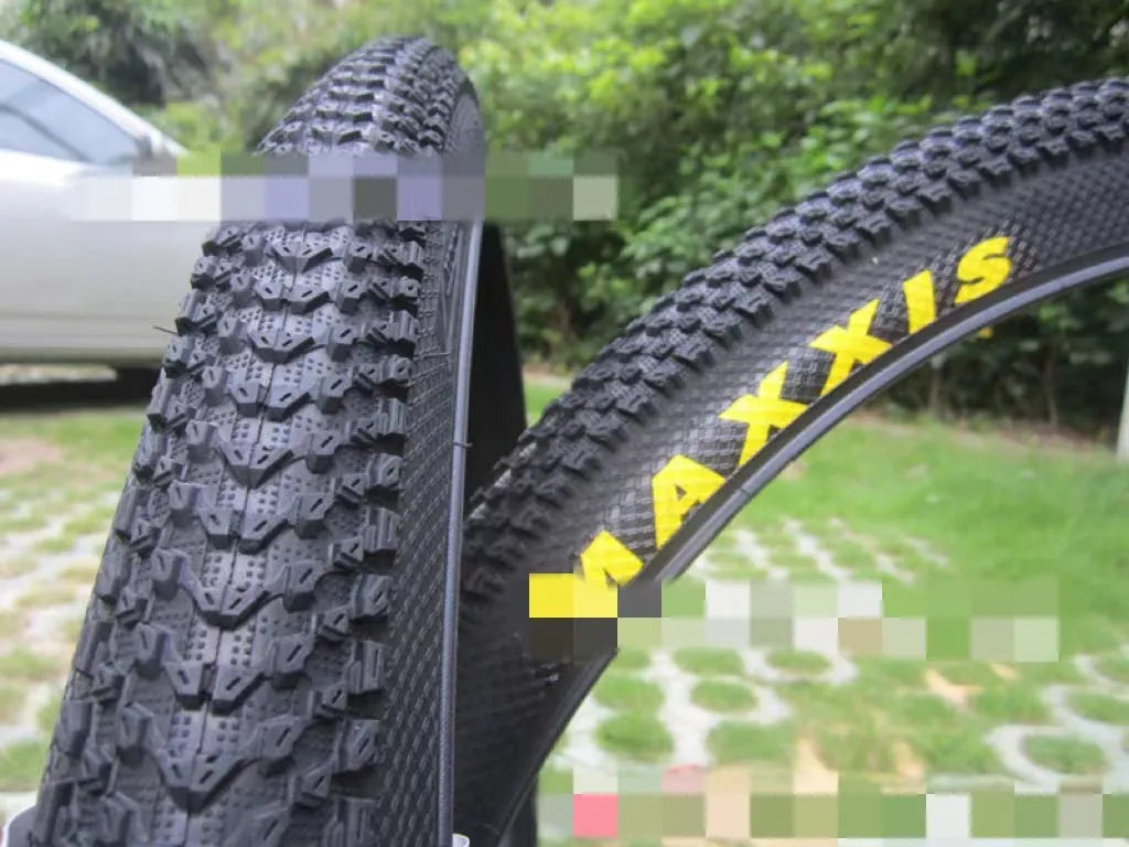 Mountain bike tyre with ultralight design, showing tread pattern and white label option, sizes from 26 to 29 inches.