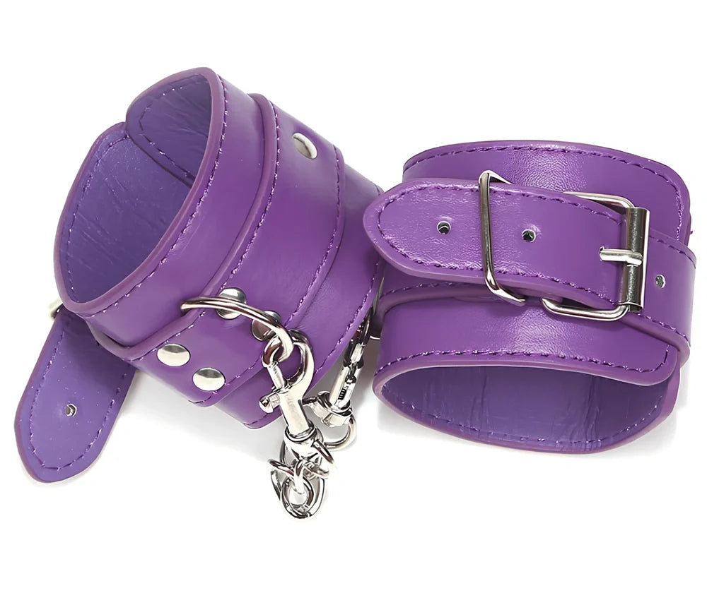 Black PU leather BDSM handcuffs showing adjustable buckle and 20cm connecting chain