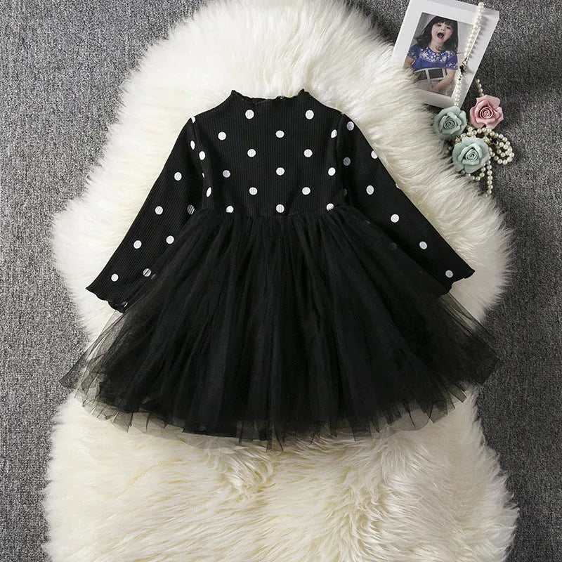Baby girl's long sleeve black tutu lace dress with lace trim, shown on a hanger.